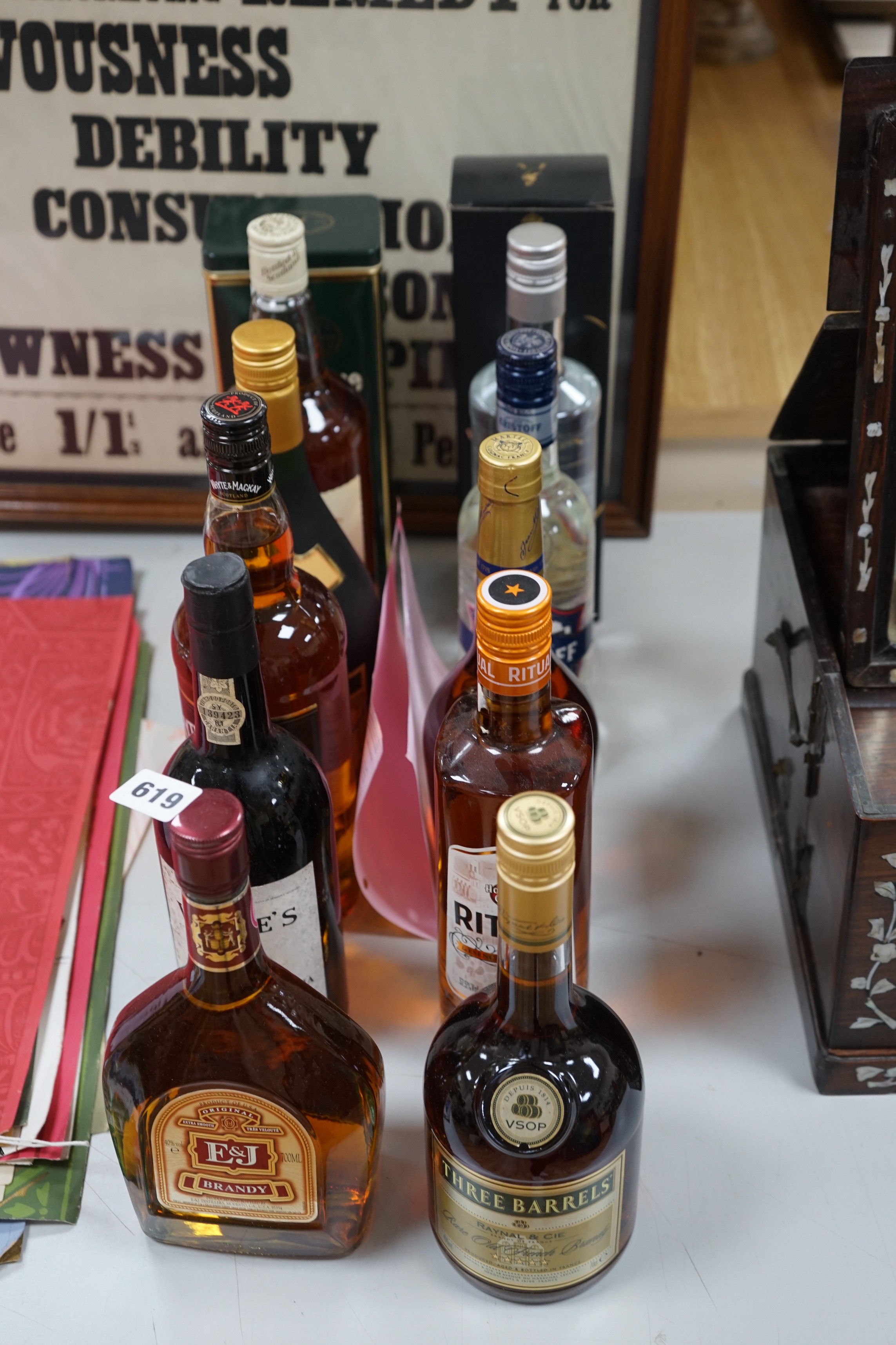 12 bottles of various alcohols to include a litre of Famous Grouse whisky, a litre of Bonaparte brandy, a litre of Whyte and Mackay, a 70cl of Johnnie Walker black label, a bottle of Tullamore Dew Whiskey, a bottle of Er